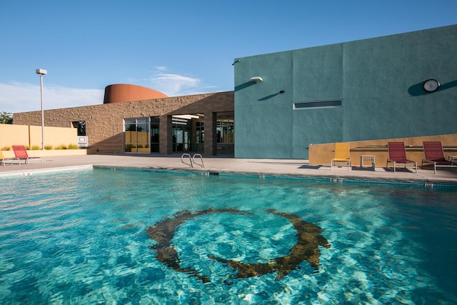 5402 Grays Peak Trl NE, Rio Rancho, NM 87144 - community pool featuring a patio