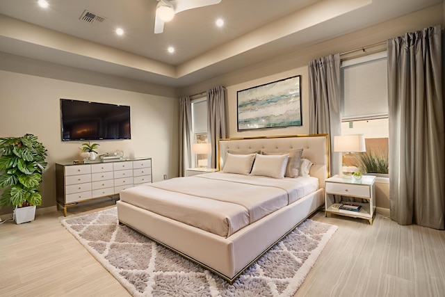 5402 Grays Peak Trl NE, Rio Rancho, NM 87144 - bedroom featuring wood finished floors, a raised ceiling, ceiling fan, and recessed lighting