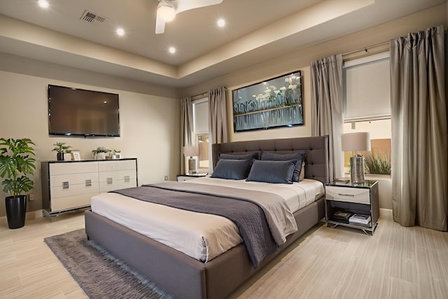 5402 Grays Peak Trl NE, Rio Rancho, NM 87144 - bedroom with light wood finished floors, a raised ceiling, recessed lighting, and a ceiling fan
