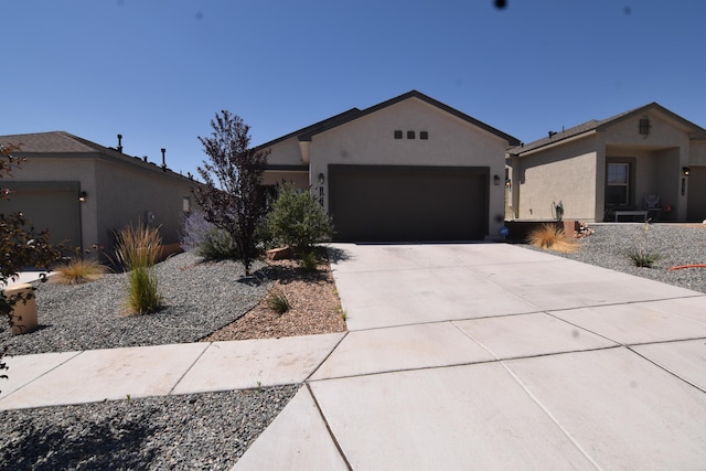 10812 Caresso SW, Albuquerque, NM 87121 - single story home featuring an attached garage, driveway, and stucco siding
