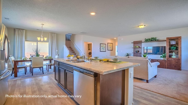 1652 Maggie Ct NE, Rio Rancho, NM 87144 - kitchen featuring stainless steel appliances, light wood-style flooring, a chandelier, a textured ceiling, and light countertops