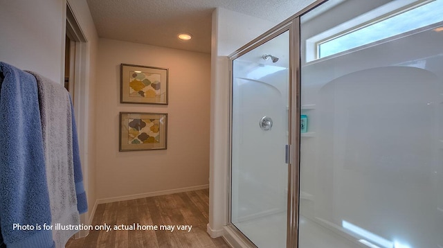 1652 Maggie Ct NE, Rio Rancho, NM 87144 - bathroom featuring wood finished floors, a stall shower, and recessed lighting