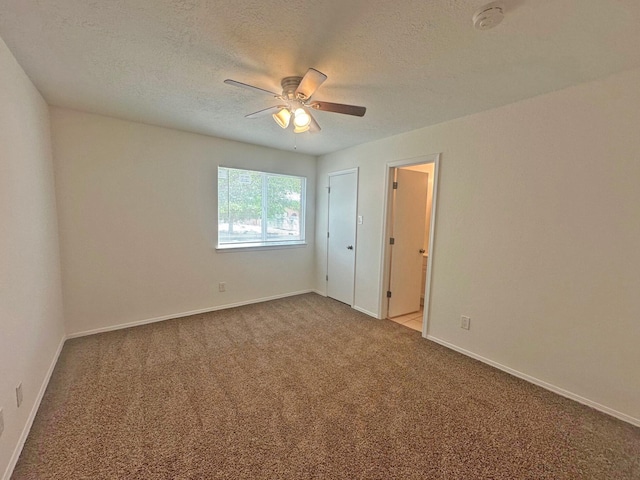 5612 Territorial Rd NW, Albuquerque, NM 87120 - unfurnished bedroom with light colored carpet, a textured ceiling, and ceiling fan