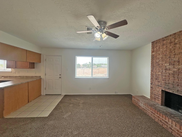 5612 Territorial Rd NW, Albuquerque, NM 87120 - unfurnished living room with a ceiling fan, a textured ceiling, a fireplace, and light colored carpet