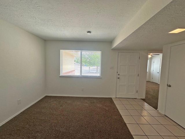 5612 Territorial Rd NW, Albuquerque, NM 87120 - foyer entrance featuring light colored carpet, a textured ceiling, light tile patterned flooring, and ceiling fan