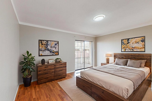 9815 Osuna Rd NE, Albuquerque, NM 87111 - bedroom with crown molding and wood finished floors