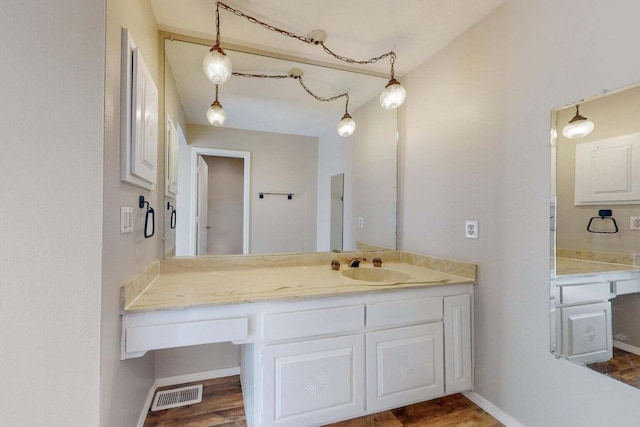 9815 Osuna Rd NE, Albuquerque, NM 87111 - bathroom featuring vanity and wood finished floors