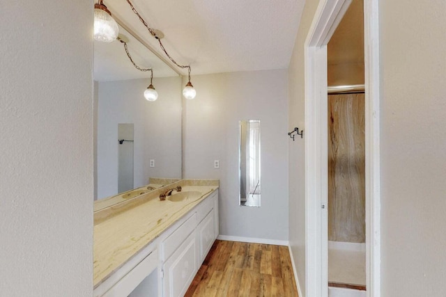 9815 Osuna Rd NE, Albuquerque, NM 87111 - bathroom featuring vanity and wood finished floors