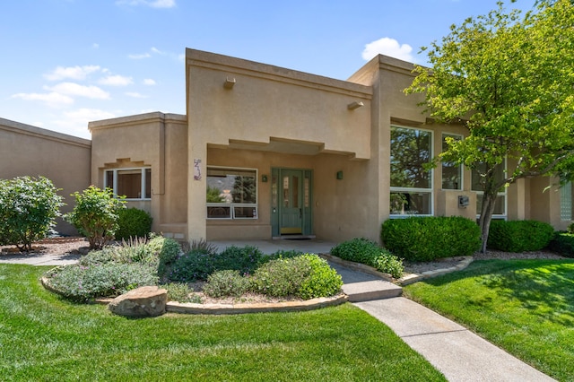 12116 Coral Dawn Rd, Albuquerque, NM 87122 - adobe home featuring stucco siding and a front lawn