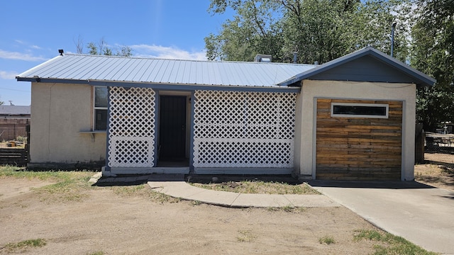 209 Campbell Ave, Belen, NM 87002 - view of front facade featuring a metal roof