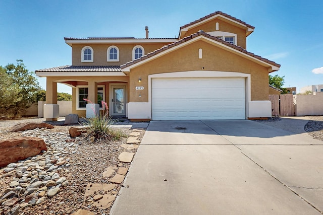 4249 Montera Pl NW, Albuquerque, NM 87114 - view of front facade with stucco siding, concrete driveway, covered porch, a garage, and a tiled roof