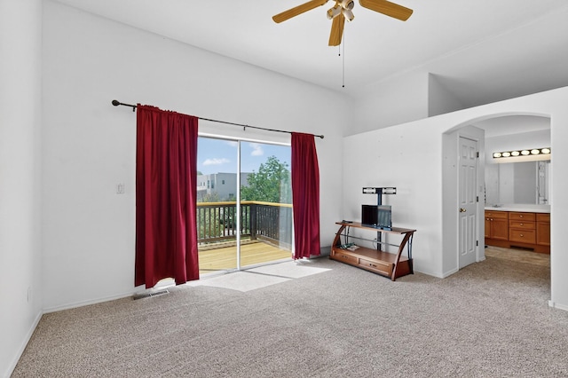 4249 Montera Pl NW, Albuquerque, NM 87114 - bedroom with access to exterior, light colored carpet, arched walkways, ensuite bathroom, and ceiling fan