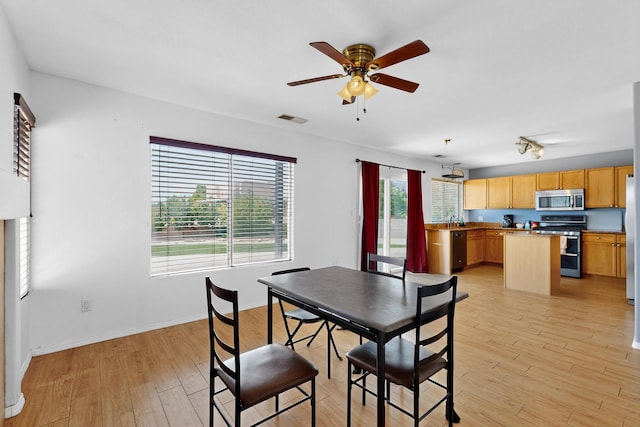 4249 Montera Pl NW, Albuquerque, NM 87114 - dining room featuring ceiling fan and light wood-style floors