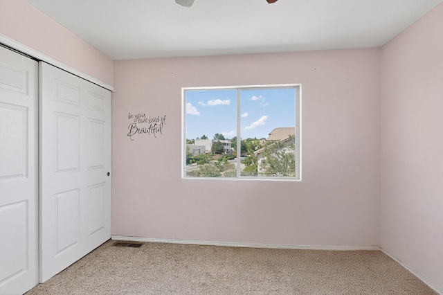 4249 Montera Pl NW, Albuquerque, NM 87114 - unfurnished bedroom with light colored carpet, a closet, and ceiling fan