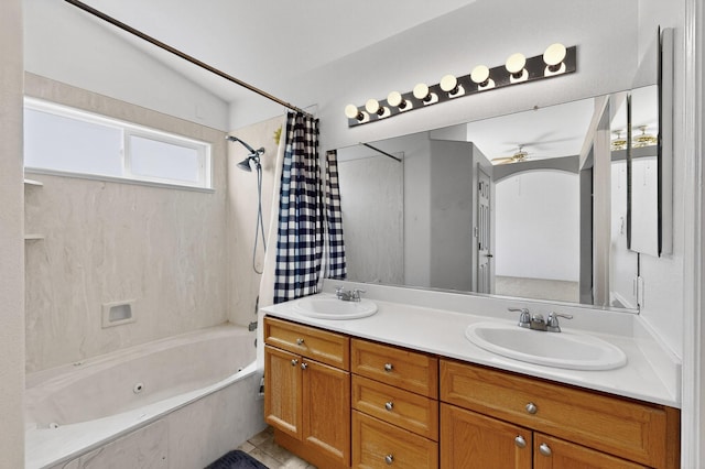 4249 Montera Pl NW, Albuquerque, NM 87114 - bathroom featuring a combined bath / shower with jetted tub, double vanity, healthy amount of natural light, and a ceiling fan