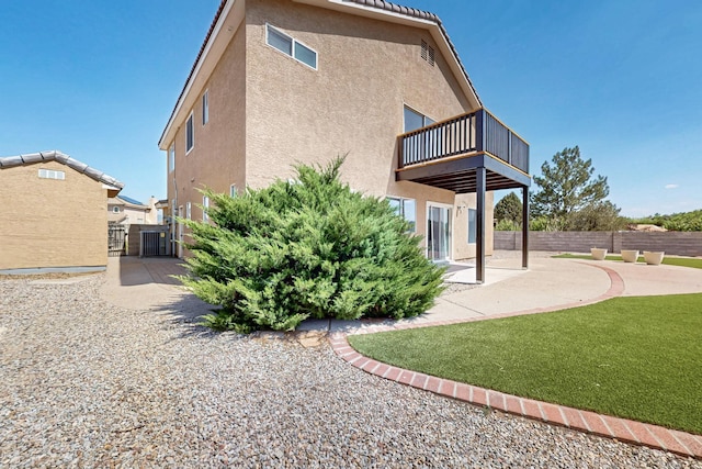 4249 Montera Pl NW, Albuquerque, NM 87114 - back of property with a balcony, stucco siding, a patio, and a gate