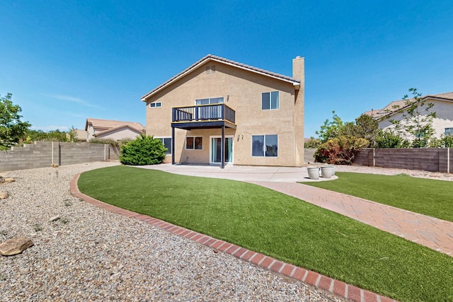 4249 Montera Pl NW, Albuquerque, NM 87114 - back of house featuring a balcony, stucco siding, a patio, and a fenced backyard