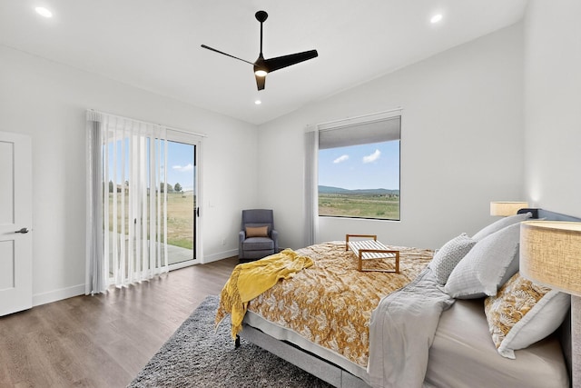 53 Blanco Dr, Edgewood, NM 87015 - bedroom with access to exterior, wood finished floors, multiple windows, vaulted ceiling, and recessed lighting