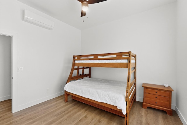 53 Blanco Dr, Edgewood, NM 87015 - bedroom featuring a wall mounted AC, wood finished floors, and a ceiling fan