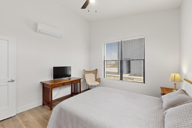53 Blanco Dr, Edgewood, NM 87015 - bedroom with an AC wall unit, wood finished floors, and ceiling fan