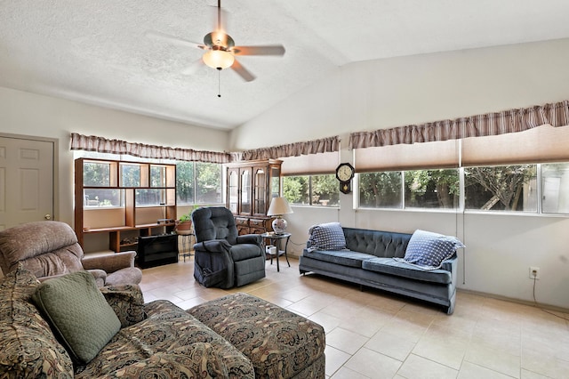 411 Schmidt Pl, Los Lunas, NM 87031 - tiled living room featuring lofted ceiling, ceiling fan, and a textured ceiling