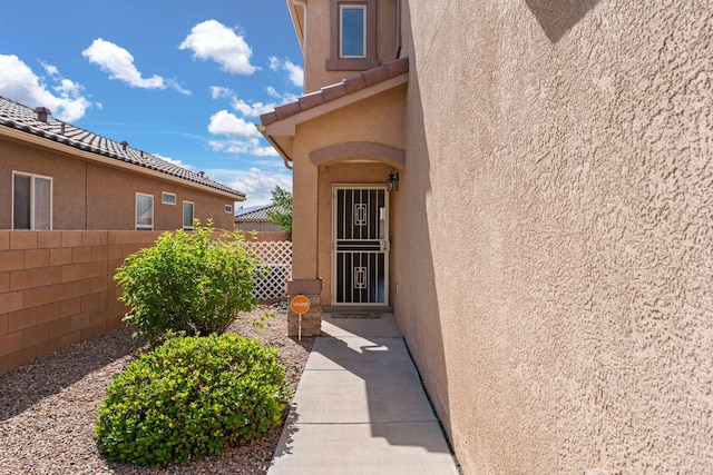 716 Palo Duro Dr, Bernalillo, NM 87004 - property entrance with stucco siding and a tile roof