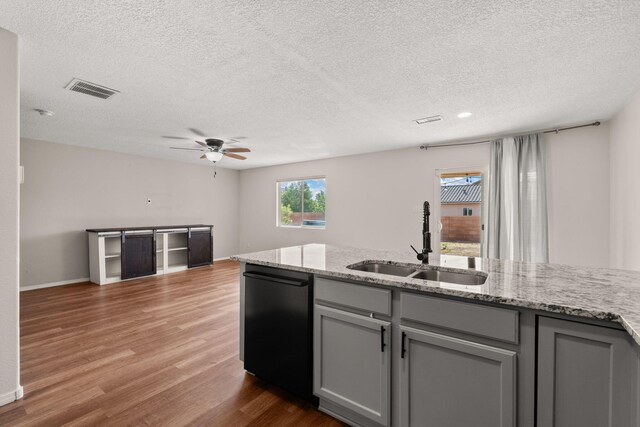 716 Palo Duro Dr, Bernalillo, NM 87004 - kitchen featuring dishwasher, gray cabinets, a textured ceiling, wood finished floors, and a ceiling fan