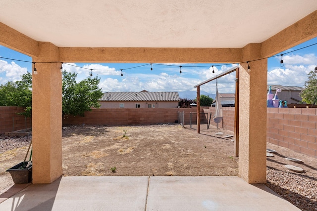 716 Palo Duro Dr, Bernalillo, NM 87004 - fenced backyard with a patio