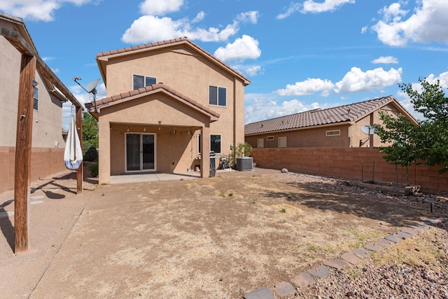 716 Palo Duro Dr, Bernalillo, NM 87004 - back of house with stucco siding, a fenced backyard, a tile roof, and a patio