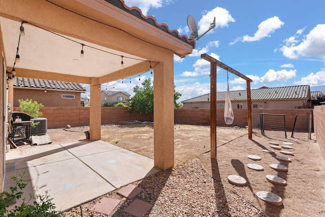 716 Palo Duro Dr, Bernalillo, NM 87004 - fenced backyard with a patio area