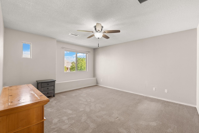 716 Palo Duro Dr, Bernalillo, NM 87004 - unfurnished bedroom with carpet floors, ceiling fan, and a textured ceiling
