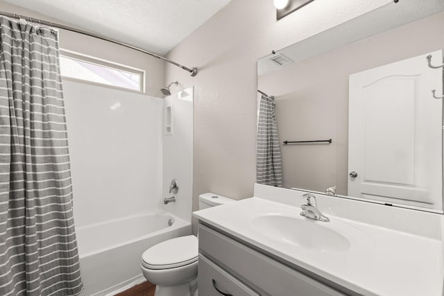 716 Palo Duro Dr, Bernalillo, NM 87004 - bathroom with shower / bathtub combination with curtain, vanity, a textured ceiling, and a textured wall