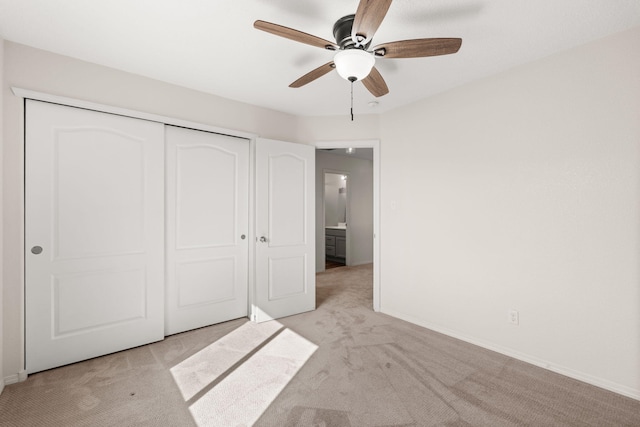 716 Palo Duro Dr, Bernalillo, NM 87004 - unfurnished bedroom with light carpet, a closet, and ceiling fan