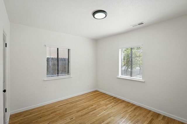 1202 Truman St SE, Albuquerque, NM 87108 - empty room featuring light wood-style flooring and baseboards