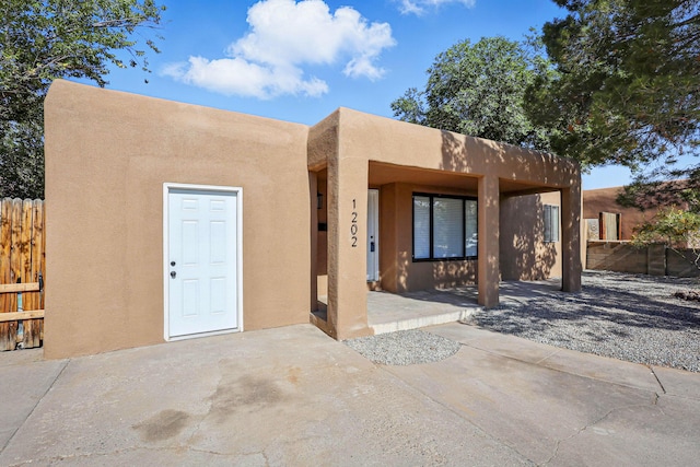 1202 Truman St SE, Albuquerque, NM 87108 - view of front of home featuring stucco siding
