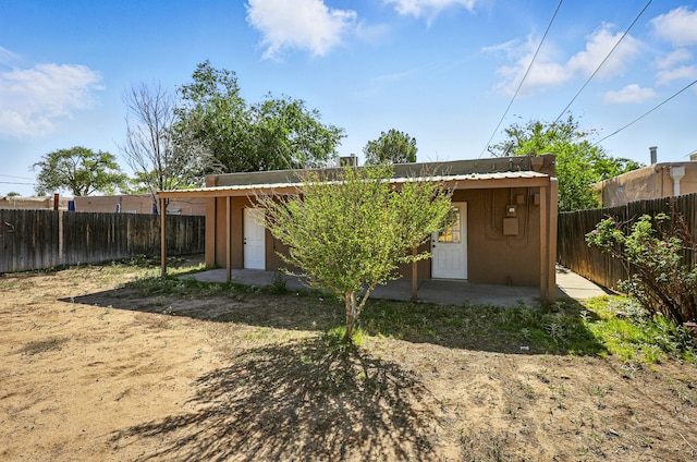 1202 Truman St SE, Albuquerque, NM 87108 - rear view of property featuring a fenced backyard and stucco siding