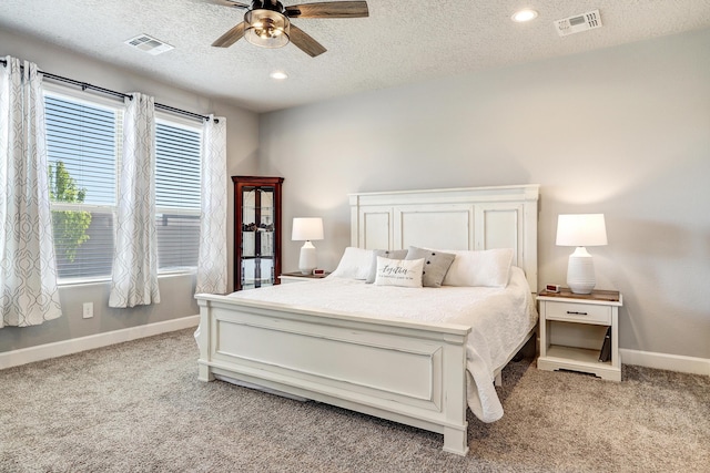 2530 Guadalupe Rd NE, Rio Rancho, NM 87144 - bedroom featuring light carpet, a textured ceiling, ceiling fan, and recessed lighting