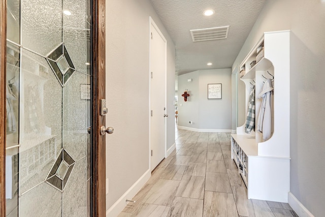 2530 Guadalupe Rd NE, Rio Rancho, NM 87144 - corridor featuring a textured ceiling and recessed lighting