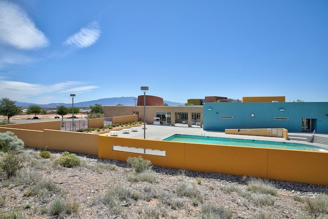 2530 Guadalupe Rd NE, Rio Rancho, NM 87144 - view of swimming pool with a mountain view
