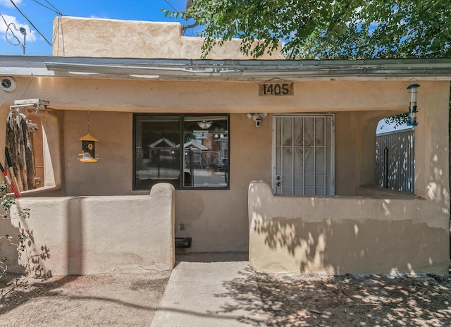 1405 3rd St SW, Albuquerque, NM 87102 - view of exterior entry featuring stucco siding