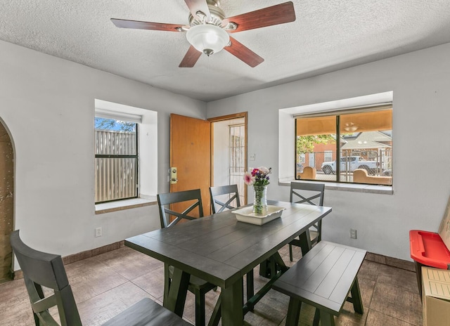1405 3rd St SW, Albuquerque, NM 87102 - dining space with plenty of natural light, a textured ceiling, ceiling fan, and arched walkways