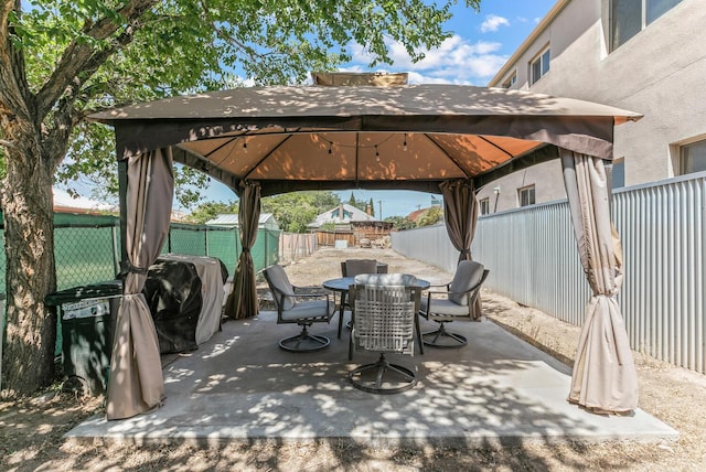 1405 3rd St SW, Albuquerque, NM 87102 - fenced backyard featuring a gazebo, outdoor dining space, and a patio area