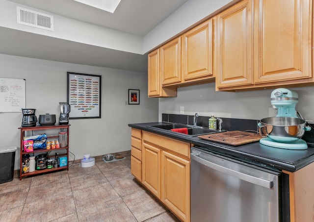 1405 3rd St SW, Albuquerque, NM 87102 - kitchen featuring dishwasher, dark countertops, and light brown cabinets