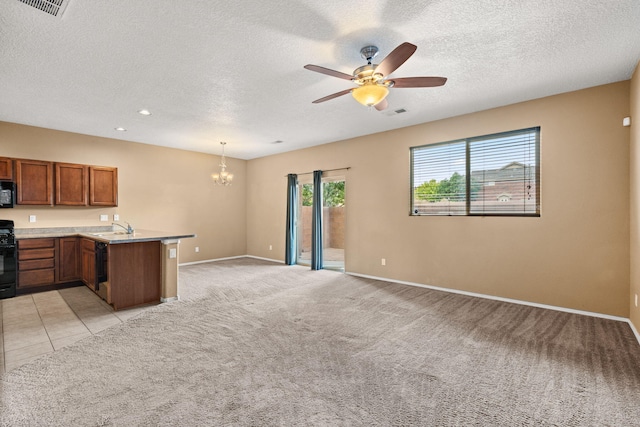 1717 Cortina Loop SE, Rio Rancho, NM 87124 - kitchen featuring a chandelier, a peninsula, brown cabinets, ceiling fan, and open floor plan