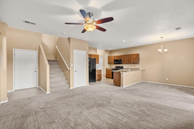 1717 Cortina Loop SE, Rio Rancho, NM 87124 - unfurnished living room with light colored carpet, a chandelier, ceiling fan, stairs, and a textured ceiling