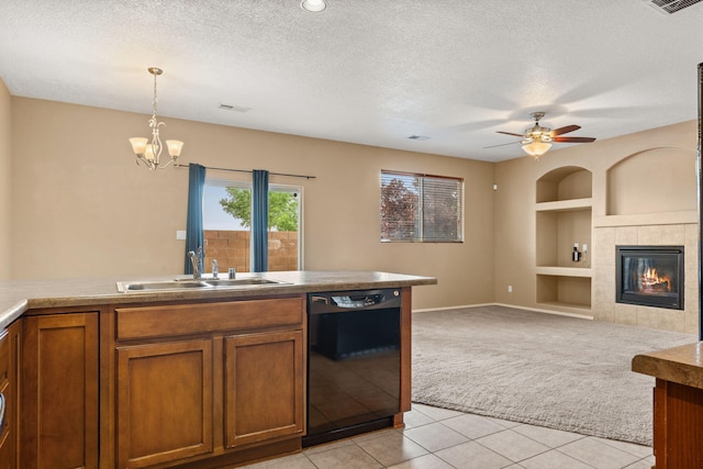 1717 Cortina Loop SE, Rio Rancho, NM 87124 - kitchen featuring black dishwasher, light colored carpet, brown cabinetry, built in features, and a textured ceiling