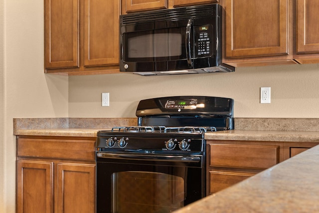 1717 Cortina Loop SE, Rio Rancho, NM 87124 - kitchen with black appliances, light countertops, and brown cabinetry