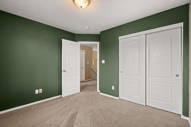 1717 Cortina Loop SE, Rio Rancho, NM 87124 - unfurnished bedroom with light carpet, a closet, and a textured ceiling