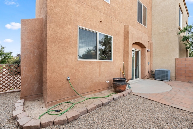 1717 Cortina Loop SE, Rio Rancho, NM 87124 - back of property featuring stucco siding and a patio