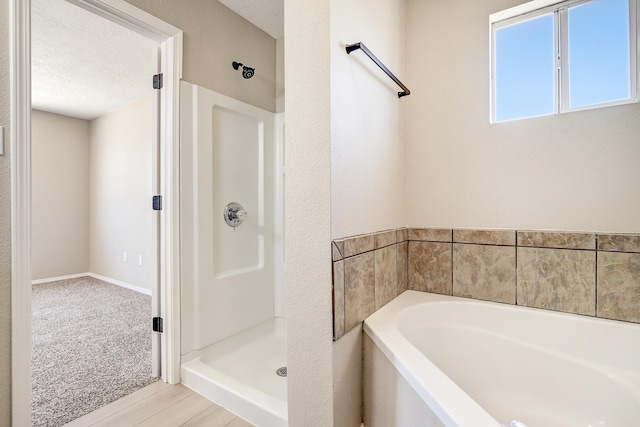 1004 11th St SE, Rio Rancho, NM 87124 - bathroom featuring a shower stall and a bath